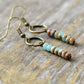 Beaded earrings on a wooden surface