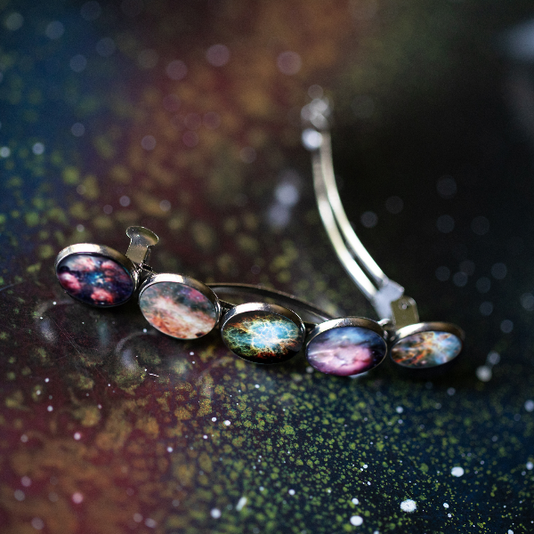 Necklace with multicolored nebula pendants on a dark, starry background