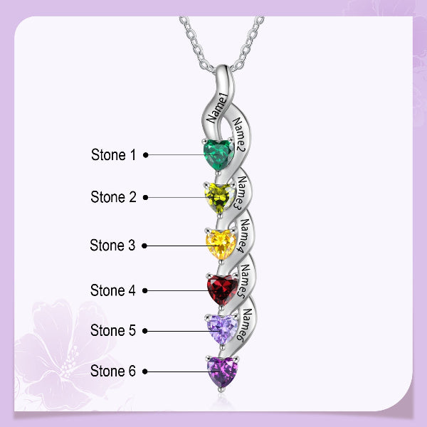 Multicolored gemstone necklace with engraved names on a light purple background