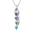 Silver necklace with heart-shaped gemstones and engraved names on a white background