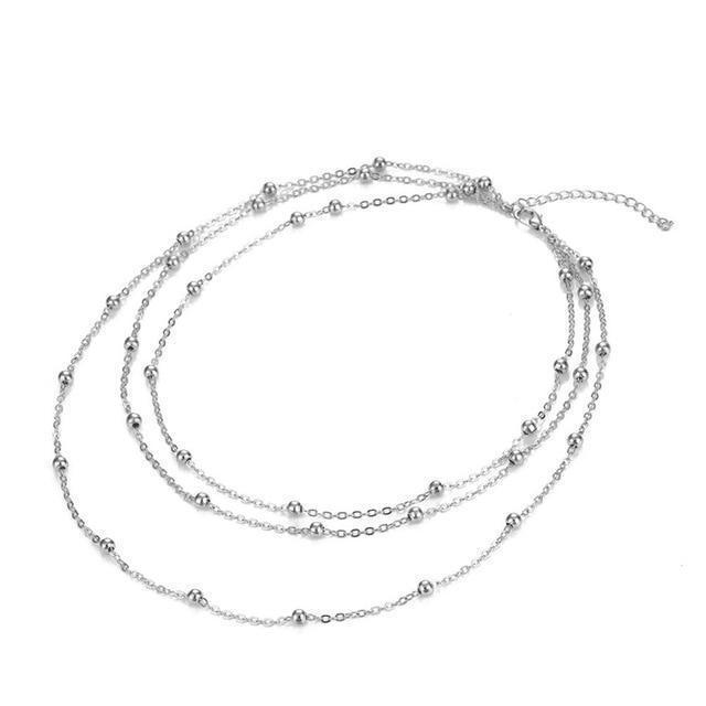 Silver chain necklace on a white background