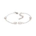 Silver bracelet with beads on a white background