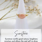 Sunstone ring on a white cone with dried flowers in the background