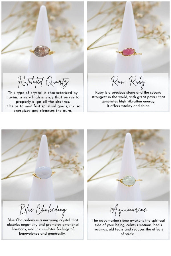 Four crystal cones with gemstones on white stands, each labeled with a different stone type and its properties.