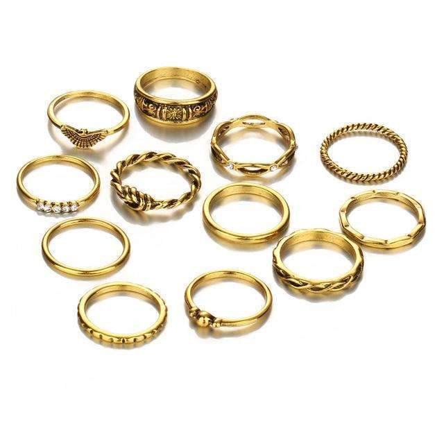 Collection of gold rings on a white background