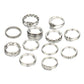 Set of silver rings with various designs on a white background