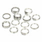 Set of silver rings with various designs on a white background