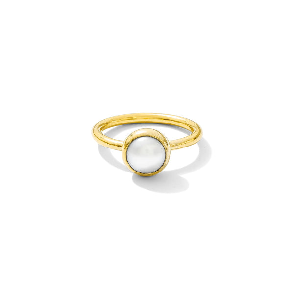 Gold ring with a white gemstone on a white background