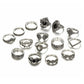 Set of silver rings with black gemstones on a white background