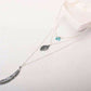 Necklace with feather pendants on a white background