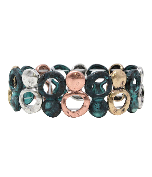 Multicolored bracelet with circular patterns on a white background