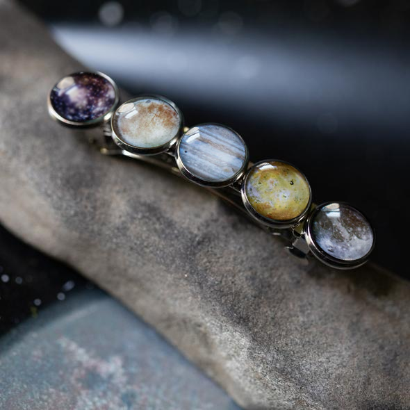 Jewelry with multicolored gemstones on a textured surface