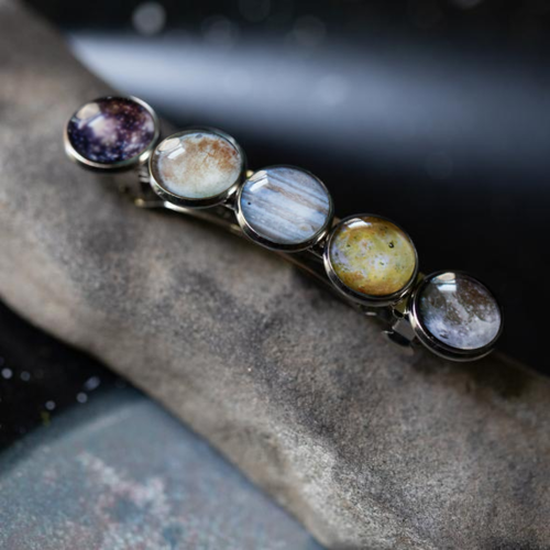 Bracelet with multicolored stones on a textured surface