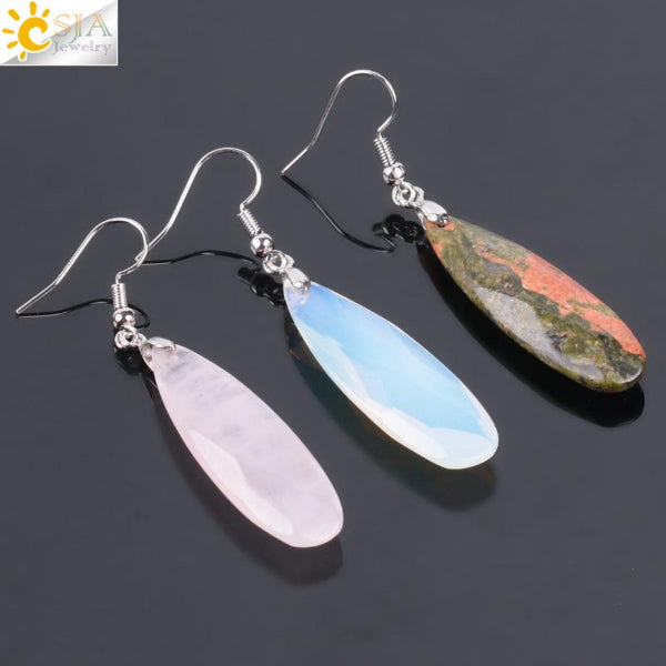 Two pairs of teardrop-shaped earrings on a dark background with 'CSIA Jewelry' logo.
