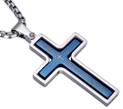 Cross-shaped pendant with blue engraving on a white background