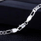 Silver chain bracelet on a black background