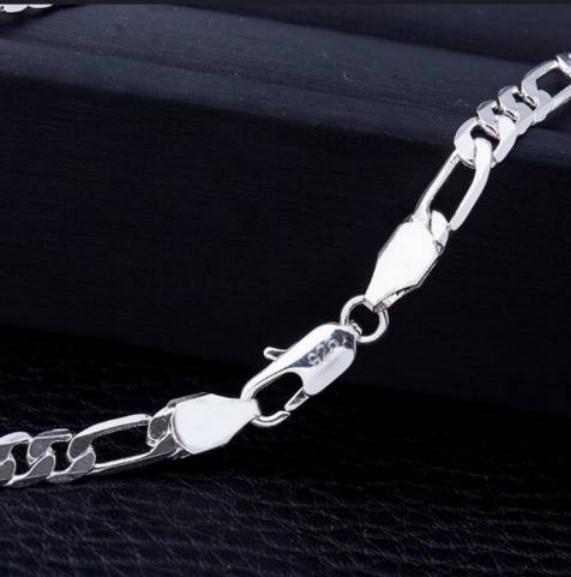 Silver chain bracelet on a black background