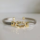 Gold and silver bracelet on a white background