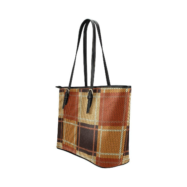 Plaid patterned tote bag with black handles on a white background