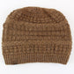 Brown knitted beanie with a brand tag on a white background